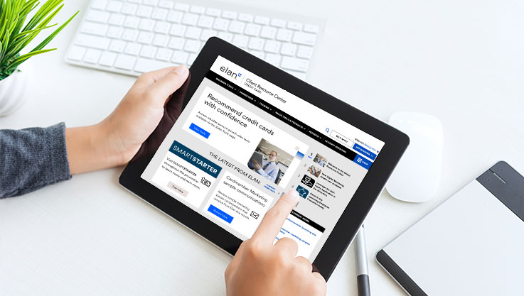 A person holds a tablet. On the screen is the homepage of the Elan Client Resource Center. 